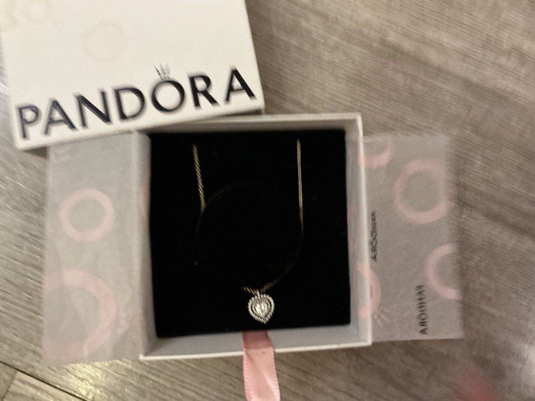 Pandora Sparkling Elevated Heart Necklace with Original Box (Category: Necklaces) located in Manila. Submitted by swifttiger_d1a8c7 (Listing ID 1470468992, Image 1). Description: - Authentic Pandora necklace - Sterling silver chain with sparkling paved heart pendant - Versatile design, easy to match with daily outfits - Includes original white Pandora box, branded tissue paper, and black velvet display insert.