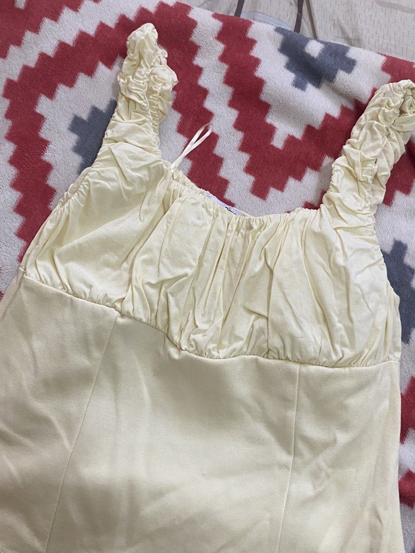 Pastel Yellow Ruched Straps Corset Style Top (Category: Sleeveless) located in Bacolor. Submitted by mxspicychicken (Listing ID 1470369767, Image 3). Description: Worn once Jnt pampanga - Color: Pastel yellow - Style: Sleeveless top with square neckline and gathered chest ruching - Details: Thick ruched straps, panel seams, curved hemline below the waist - Condition: Worn once, part of a closet cleanout - Pairing: Easy to match with high-waisted 
