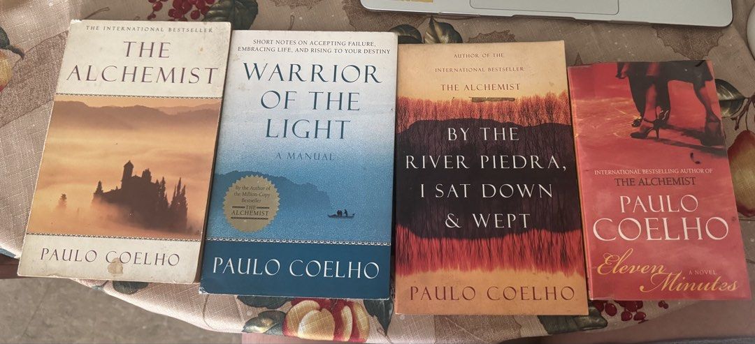 Paulo Coelho Book Bundle - 4 Novels (Category: Storybooks) located in Paranaque City. Submitted by jiggybautista (Listing ID 1470368144, Image 1). Description: - Bundle of 4 Paulo Coelho bestselling novels - Titles included: The Alchemist, Warrior of the Light, By the River Piedra I Sat Down & Wept, and Eleven Minutes - Format: Paperback (HarperPerennial & Harper Torch Fiction) - Condition: Pages have yellowing from age/storage; covers have minor