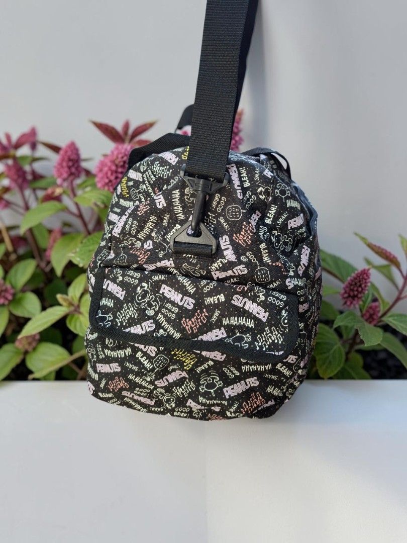 PEANUTS MONOGRAM FABRIC 2WAY TRAVEL DUFFEL BAG (Category: Cross-body Bags) located in Las Pinas. Submitted by annachiaonair2037 (Listing ID 1470354939, Image 3). Description: PEANUTS MONOGRAM FABRIC COTTON 2WAY TRAVEL DUFFEL BAG FROM JAPAN DETACHABLE ADJUSTABLE STRAP H 15.5" L 24" W 10" Disclaimer: I am not affiliated with, associated with, or authorized by any of the brands featured posted. Any mention of brand names, trademarks, or logos is sol