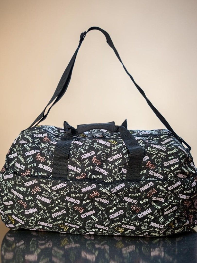 PEANUTS MONOGRAM FABRIC 2WAY TRAVEL DUFFEL BAG (Category: Cross-body Bags) located in Las Pinas. Submitted by annachiaonair2037 (Listing ID 1470354939, Image 2). Description: PEANUTS MONOGRAM FABRIC COTTON 2WAY TRAVEL DUFFEL BAG FROM JAPAN DETACHABLE ADJUSTABLE STRAP H 15.5" L 24" W 10" Disclaimer: I am not affiliated with, associated with, or authorized by any of the brands featured posted. Any mention of brand names, trademarks, or logos is sol