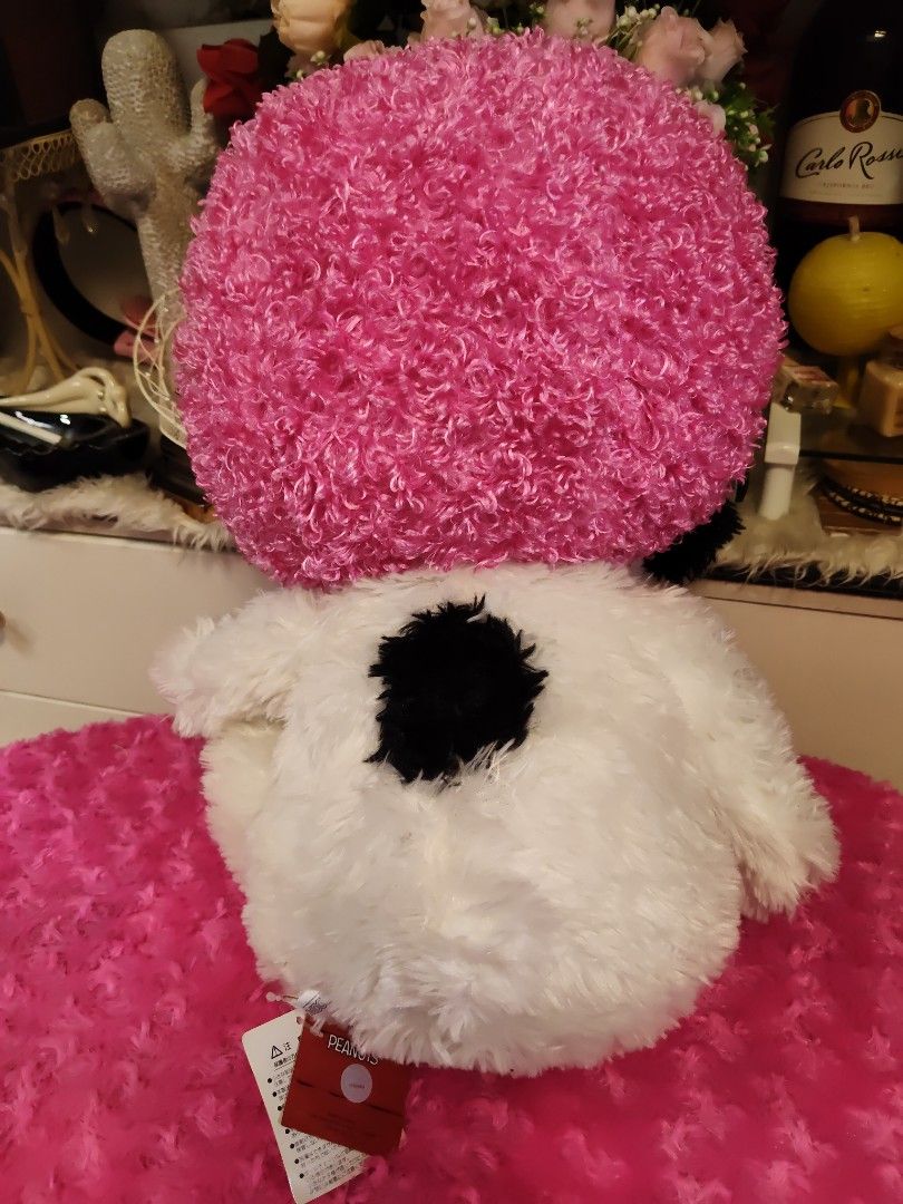 PEANUTS Snoopy Plush Toy with Pink Afro Wig (Category: Plushies & Soft Toys) located in Pasay City. Submitted by ynamariie (Listing ID 1470423300, Image 3). Description: - Large Snoopy plush toy with super soft texture - Features a fun, bright pink curly afro hat - Official PEANUTS merchandise tag attached - Comes with original Japanese product and safety tags - 100% clean and well-maintained condition - Perfect gift for Snoopy fans and collector