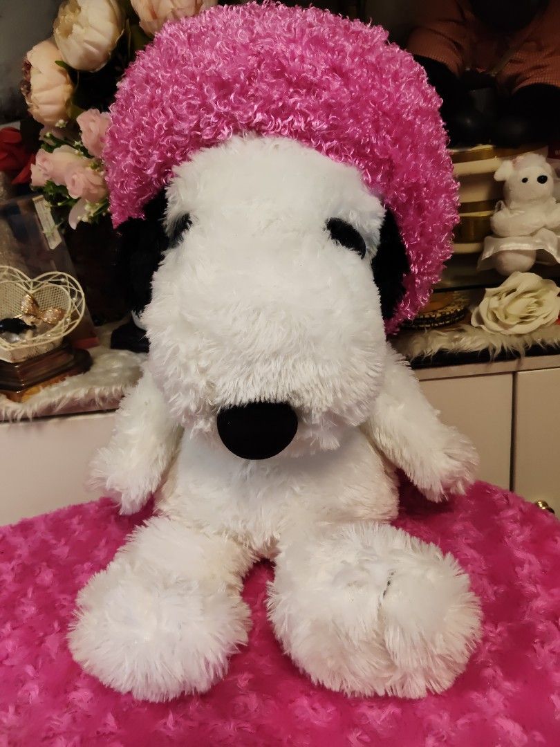 PEANUTS Snoopy Plush Toy with Pink Afro Wig (Category: Plushies & Soft Toys) located in Pasay City. Submitted by ynamariie (Listing ID 1470423300, Image 1). Description: - Large Snoopy plush toy with super soft texture - Features a fun, bright pink curly afro hat - Official PEANUTS merchandise tag attached - Comes with original Japanese product and safety tags - 100% clean and well-maintained condition - Perfect gift for Snoopy fans and collector