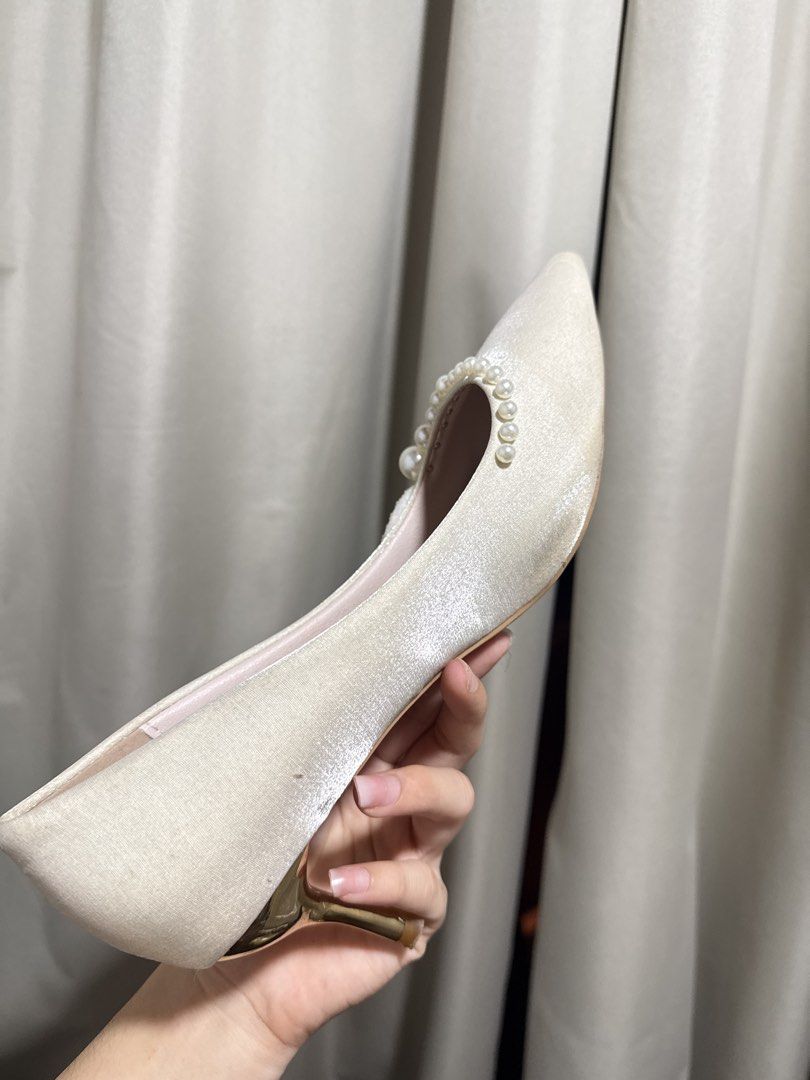 Pearl Embellished Pointed Toe Kitten Heels Cream (Category: Heels) located in Abucay. Submitted by fastlion.584bdf (Listing ID 1470532641, Image 3). Description: - Color & Material: Cream satin upper with cute pink inner lining - Design: Pointed toe slip-on with delicate pearl and petal collar decorations - Heel: Eye-catching shiny metallic gold kitten heel - Size: 250 (approx. US 7.5 / EU 38) - Condition: Pre-loved with light wear on the outer s