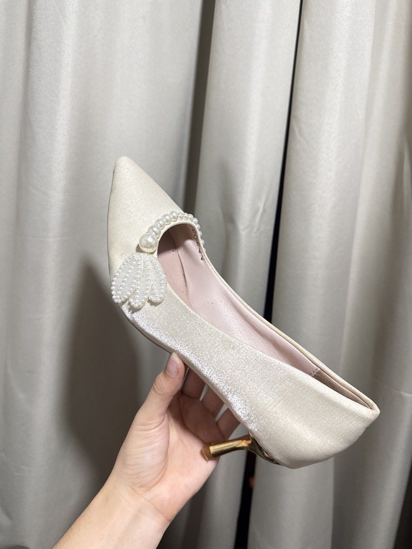 Pearl Embellished Pointed Toe Kitten Heels Cream (Category: Heels) located in Abucay. Submitted by fastlion.584bdf (Listing ID 1470532641, Image 1). Description: - Color & Material: Cream satin upper with cute pink inner lining - Design: Pointed toe slip-on with delicate pearl and petal collar decorations - Heel: Eye-catching shiny metallic gold kitten heel - Size: 250 (approx. US 7.5 / EU 38) - Condition: Pre-loved with light wear on the outer s