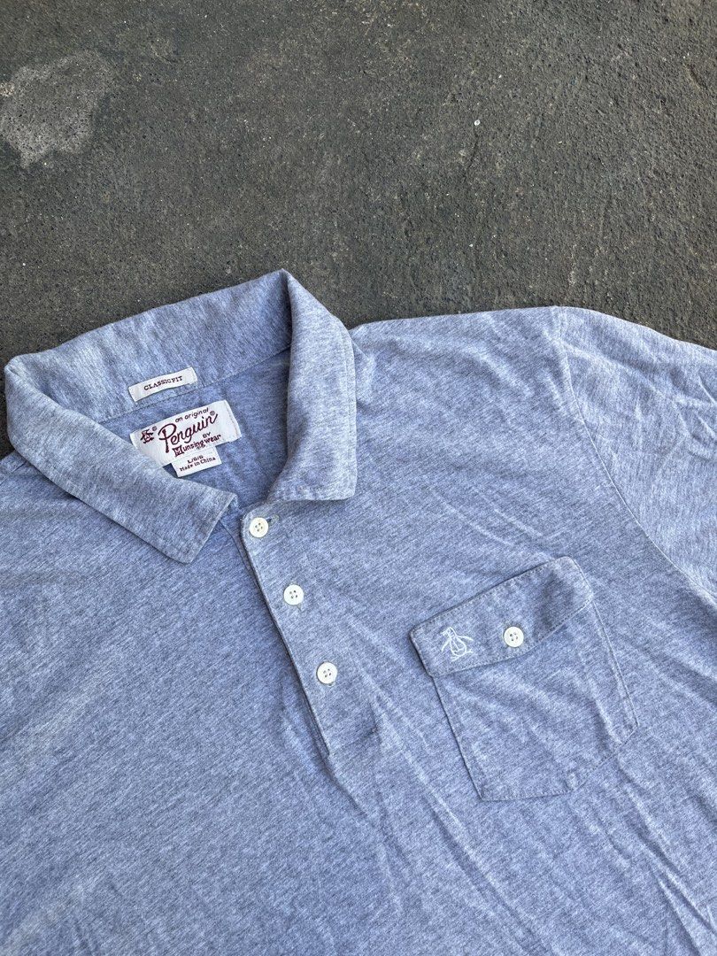 Penguin Pocket Polo Shirt (Category: Formal Shirts) located in Manila. Submitted by a.stmngo (Listing ID 1470351048, Image 2). Description: Size Large on tag Width 21 inches Length 27 inches No issue Good Condition 📍Manage your expectation. Item is thrifted. 📍Nagcarlan, Laguna.
