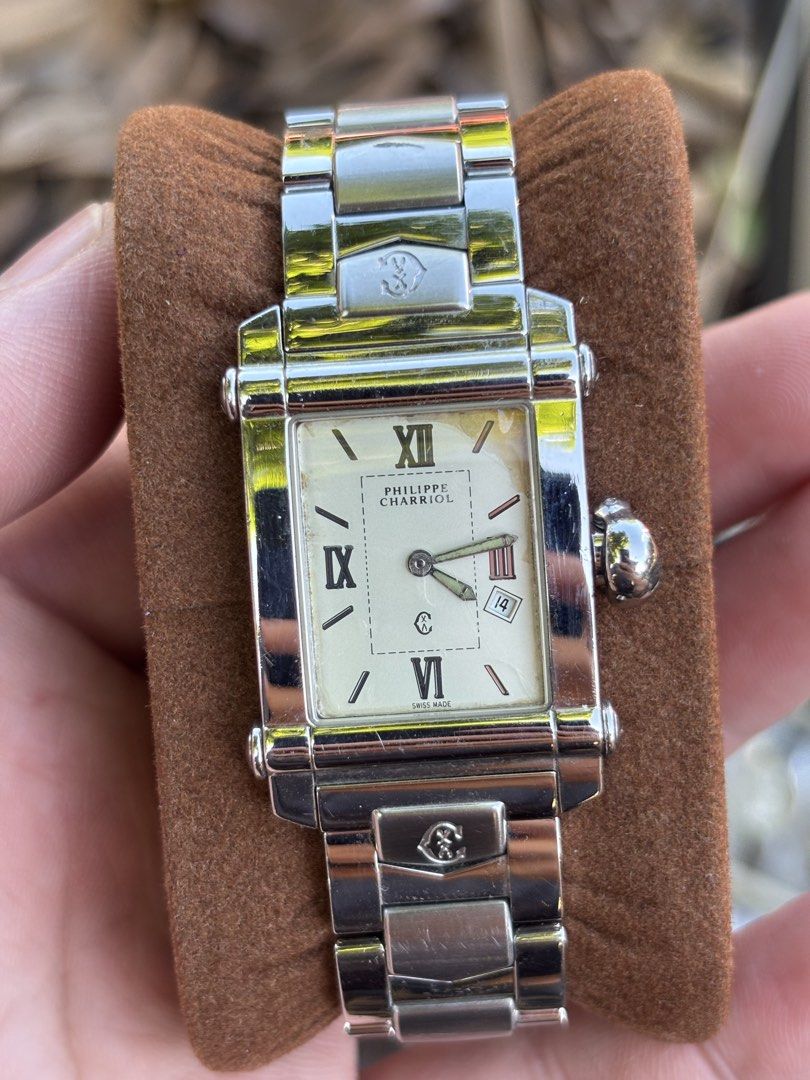 Philippe Charriol Actor - Stainless Steel Rectangular Quartz (Category: Luxury Watches) located in Manila. Submitted by maxxxxxxxxxxxx (Listing ID 1470465078, Image 2). Description: This is a Philippe Charriol “Actor” model, characterized by its distinct rectangular profile and integrated bracelet design. Dial: The watch features a crisp white dial with silver-tone Roman numeral hour markers at the 3, 6, 9, and 12 o’clock positions, complemented 