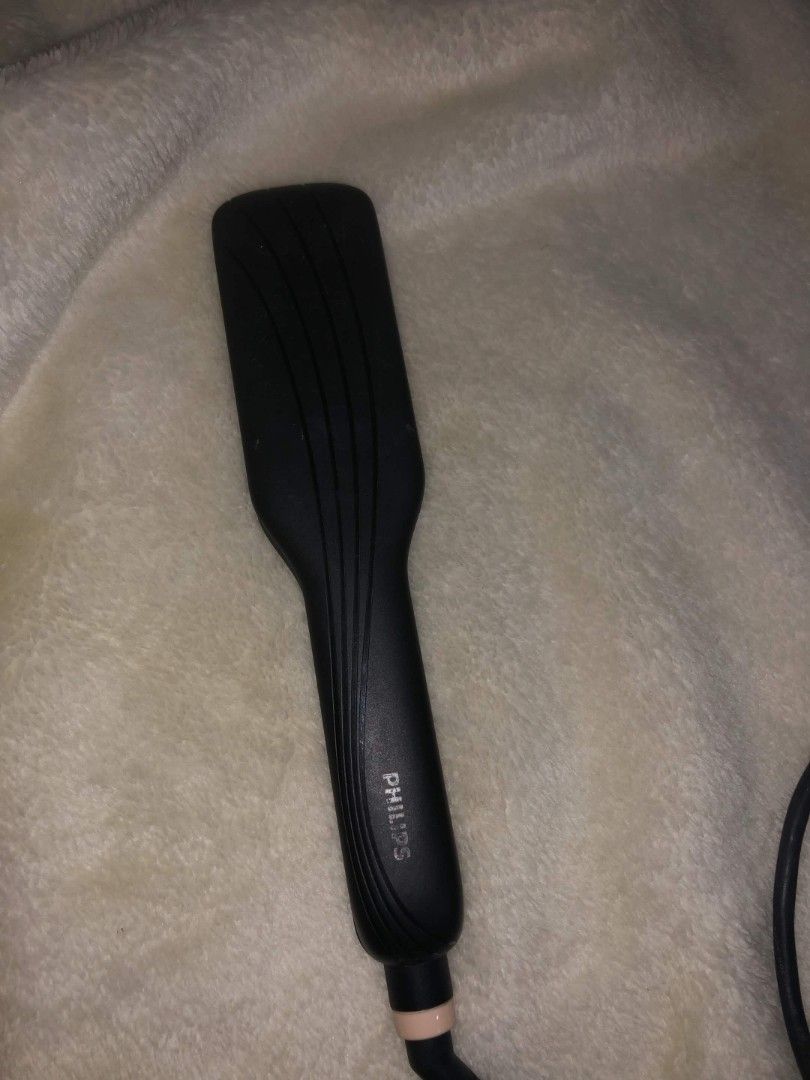 Philips Hair Straightener (Category: Hair) located in Las Pinas. Submitted by armariodemaria (Listing ID 1470545979, Image 2). Description: - Brand: Philips - Color: Black with cute pink ceramic plates - Condition: Clean body with minimal wear, works great - Performance: Heats up quickly for fast straightening - Design: Slim and lightweight, perfect for travel - Plug: Standard plug attached.