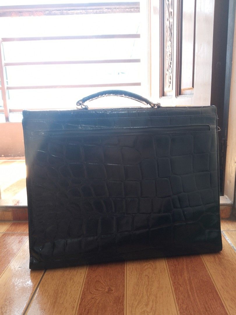 Vintage Picard Briefcase (Category: Briefcases) located in Pasig City. Submitted by jpgallardo (Listing ID 1470447253, Image 3). Description: - Authentic Picard briefcase, Made in Germany - Premium black leather with embossed crocodile texture - Flap front closure with secure double twist locks - Convenient top handle and exterior back zip pocket - Vibrant, colorful printed fabric interior lining - Features a secure zippered inner pocket and silv