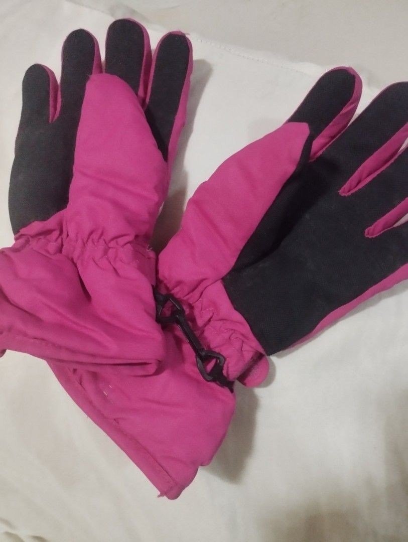 Pink and black winter ski gloves (Category: Gloves) located in Manila. Submitted by iamnicka (Listing ID 1470475810, Image 1). Description: - Color: Bright pink with black textured palms and fingers - Warm & Secure: Elastic wrists keep out the cold snow - Loss Prevention: Includes a plastic clip to keep the pair together - Versatile Use: Great for skiing, snowboarding, or casual cold weather outdoor play.