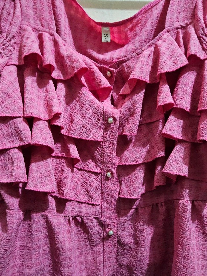 Pink Coquette Classy Flowy Ruffled Top (Category: Longsleeves) located in Taguig. Submitted by ynascorner_ (Listing ID 1470368304, Image 3). Description: pink ruffled top ⭐️ • size is not indicated but fits up to XL bodyframe • buttons are detangled easily • manage your expectations, this is thrifted top!.