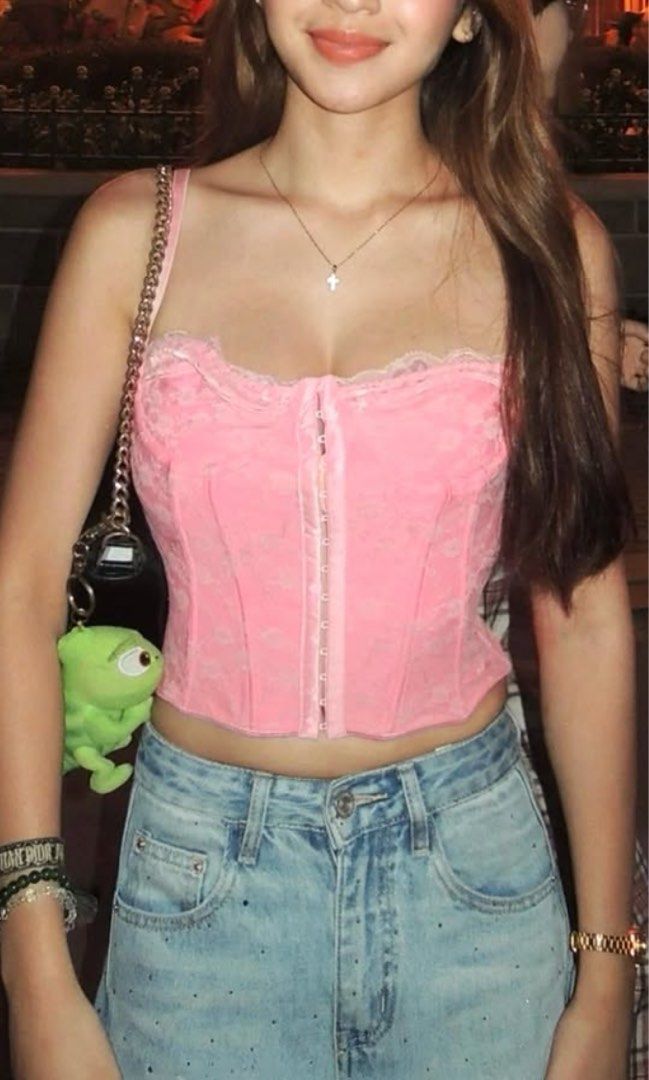 Pink Corset Top (Category: Sleeveless) located in Rizal. Submitted by ykning (Listing ID 1470361782, Image 1). Description: - Color/Style: Pink corset top with delicate lace trim - Closure: Front hook-and-eye closure - Fit: Cropped fit, great to pair with high-waisted denim - Condition: Worn once, clean, and ready to wear.