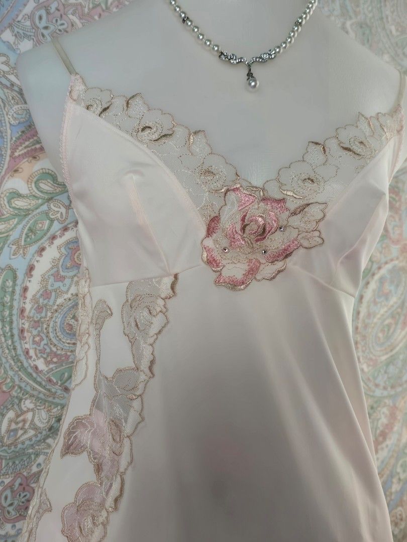 Pink Lace Trim Slip Top (Category: Dresses) located in Dagupan City. Submitted by chislocker14 (Listing ID 1470364347, Image 2). Description: - Color: Soft pink - Design: Slip dress with rose embroidery and sparkly rhinestone accents - Back: Sheer polka dot mesh panel - Hem: Layered pink ruffles - Straps: Adjustable spaghetti straps.