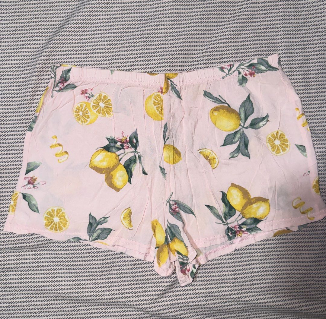 Pink Lemon Print Pajama Shorts (Category: Shorts) located in Santa Ana. Submitted by fatikilla (Listing ID 1470464751, Image 1). Description: - Size: Medium - Design: Pink with bright yellow lemons and green leaves - Comfort: Stretchable elastic waistband for easy wear - Material: Lightweight fabric - Ideal for: Sleeping or cozy lounging at home.