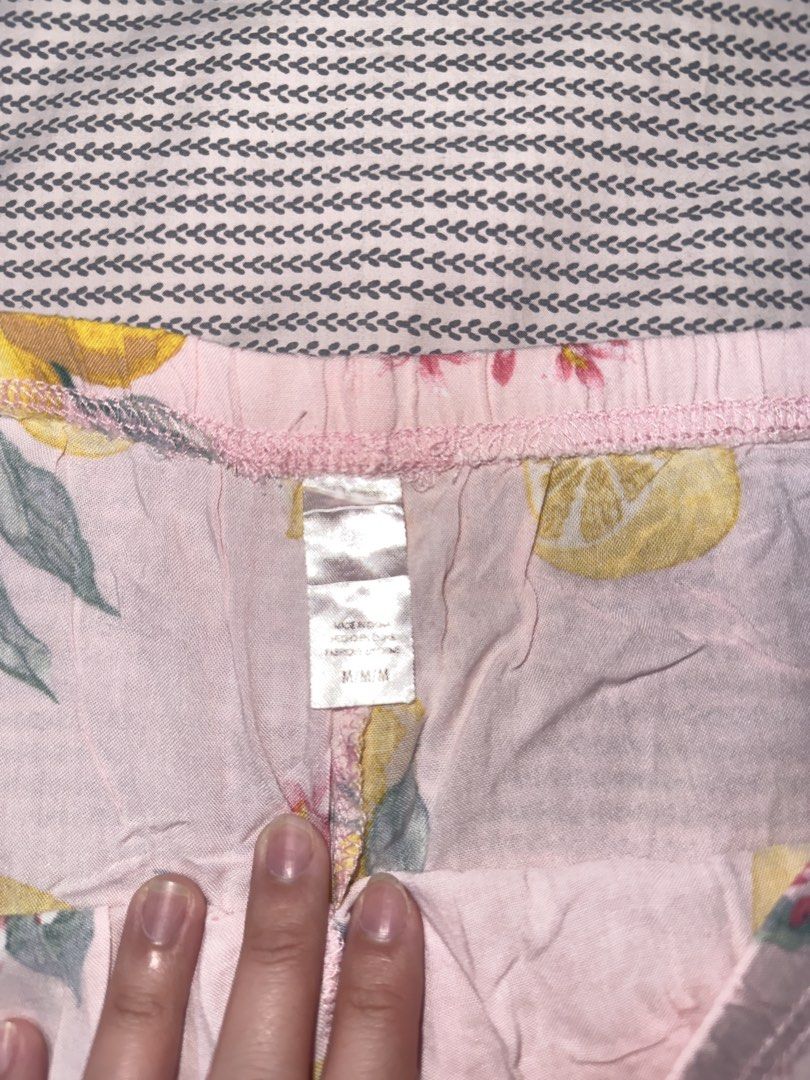 Pink Lemon Print Pajama Shorts (Category: Shorts) located in Santa Ana. Submitted by fatikilla (Listing ID 1470464751, Image 2). Description: - Size: Medium - Design: Pink with bright yellow lemons and green leaves - Comfort: Stretchable elastic waistband for easy wear - Material: Lightweight fabric - Ideal for: Sleeping or cozy lounging at home.