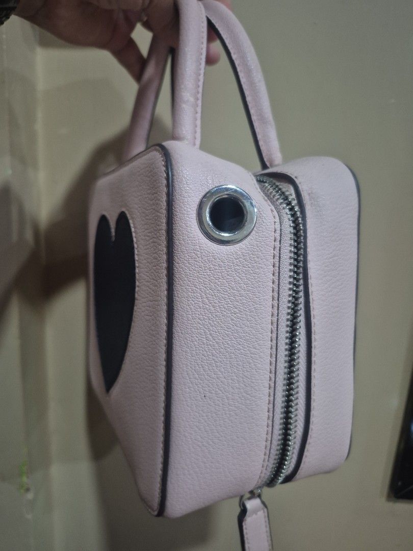 Pink structured mini handbag with top handles and zipper (Category: Luxury Bags & Wallets) located in Iloilo. Submitted by gorgeoustatz (Listing ID 1470416095, Image 2). Description: - Color: Light pink - Material: Clean faux leather - Hardware: Silver-tone zippers - Design: Structured and minimalist - Features: Dual top handles, protective metal feet on the bottom - Size: Compact, perfect for daily essentials FREE for at least 2K purchase.