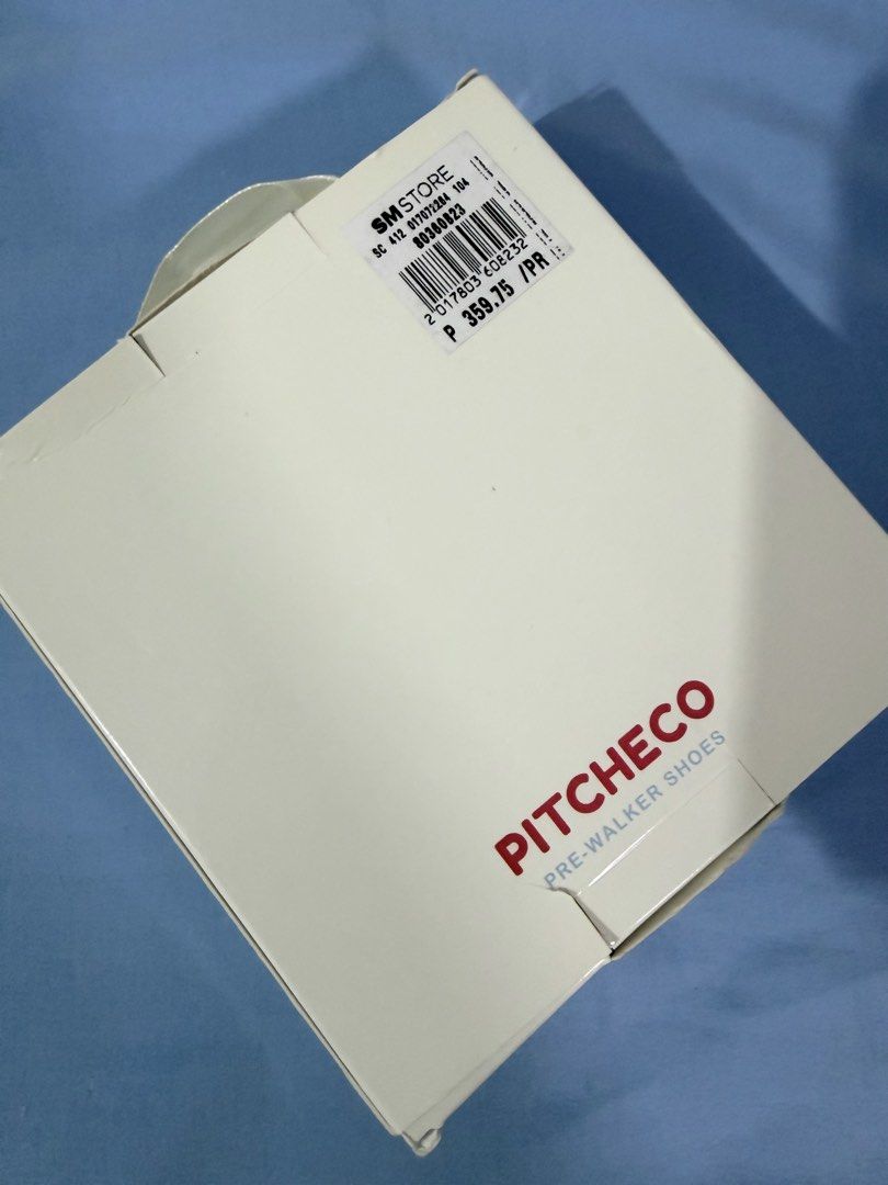 Pitcheco White Pre-Walker Shoes Size 13 9-12 Months (Category: Babies & Kids Fashion) located in Tanza. Submitted by calmwind_2a9316 (Listing ID 1470512189, Image 2). Description: - Brand: Pitcheco - Color: White - Size: 13 (Fits babies 9 to 12 months) - Design: Delicate mesh bow with a small pearl detail in the center - Fit: Elastic strap across the top for a secure and comfortable fit - Condition: Like new with original box and retail price tag