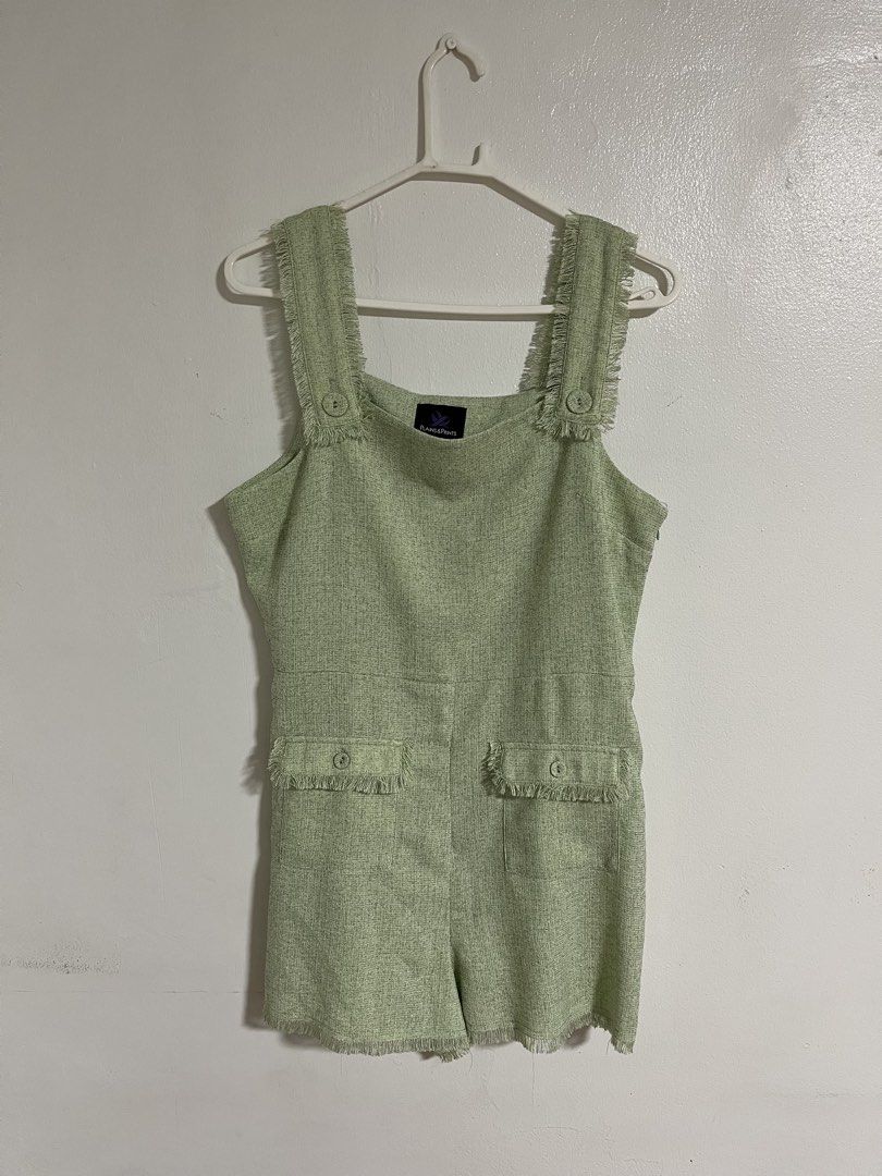 Plains & Prints Green Tweed Romper (Category: Rompers) located in Cabuyao City. Submitted by rdtrmt (Listing ID 1470403564, Image 1). Description: - Brand: Plains & Prints - Item: Sage Green Tweed Romper - Size: PH L / UK 12 / US 8 - Design: Square neckline with fringe trim, front pockets with button & fringe details - Closure: Side zipper - Fit: Tailored fit with shorts bottom - Condition: Clean fabric finish; still in good condition.
