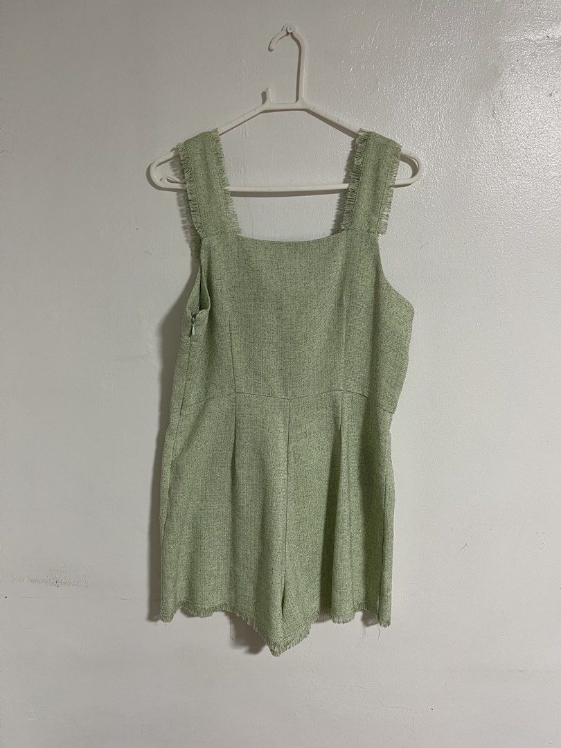 Plains & Prints Green Tweed Romper (Category: Rompers) located in Cabuyao City. Submitted by rdtrmt (Listing ID 1470403564, Image 3). Description: - Brand: Plains & Prints - Item: Sage Green Tweed Romper - Size: PH L / UK 12 / US 8 - Design: Square neckline with fringe trim, front pockets with button & fringe details - Closure: Side zipper - Fit: Tailored fit with shorts bottom - Condition: Clean fabric finish; still in good condition.