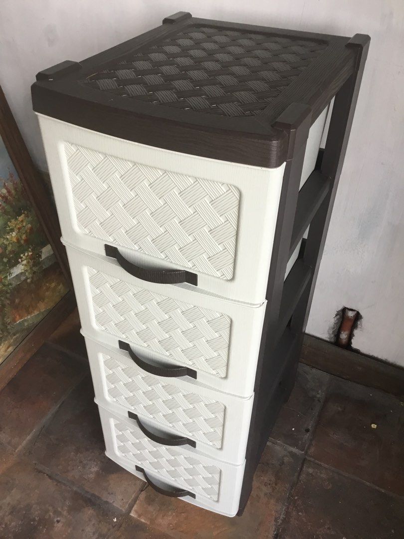 Plastic 4-Tier Storage Drawer Cabinet with Rattan Design (Category: Shelves, Cabinets & Racks) located in Manila. Submitted by roberto.enriquez (Listing ID 1470556575, Image 3). Description: - 4-tier plastic storage cabinet with a stylish aesthetic - Cream white drawers featuring a woven rattan texture - Elegant dark brown frame, top surface, and curved handles - Sturdy and durable construction for everyday use - Ideal for organizing clothes, toy