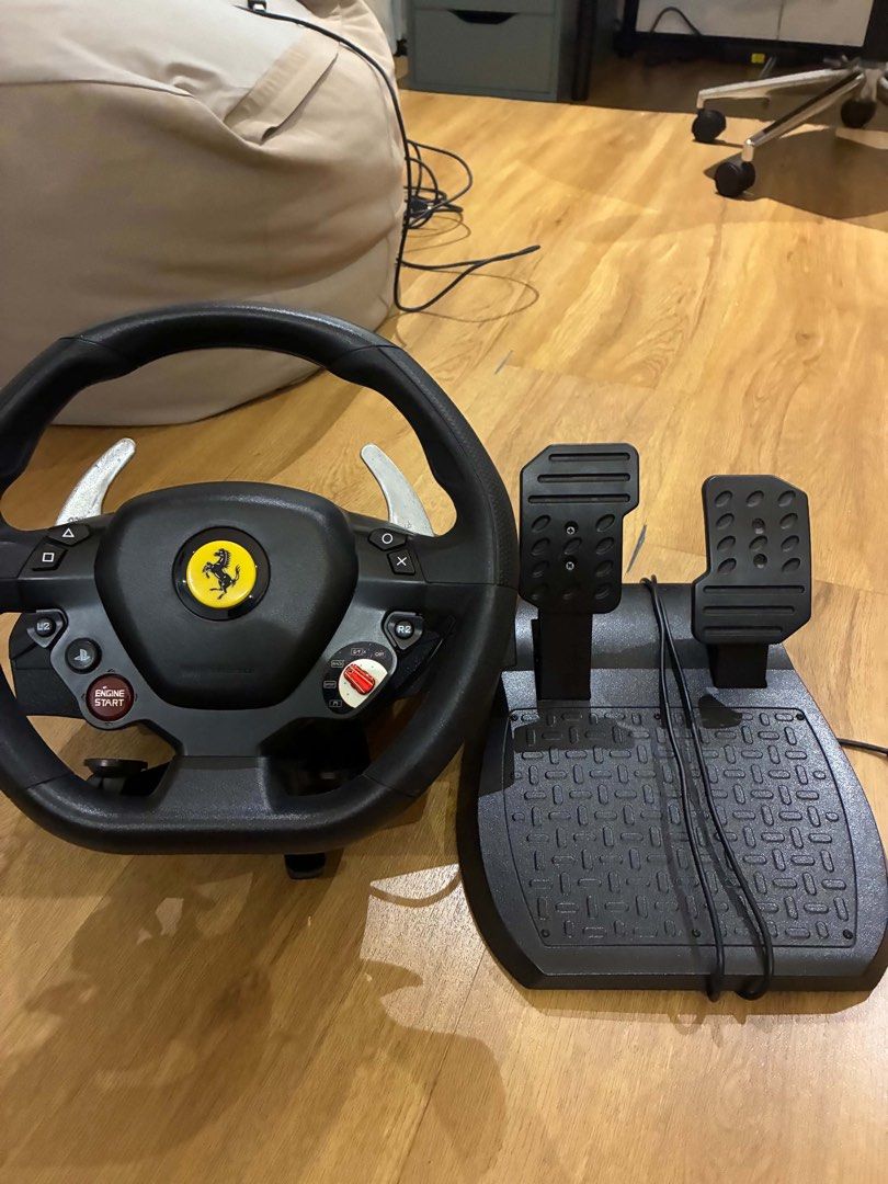 PlayStation 4 Console, Controllers, Thrustmaster Racing Wheel, and Games (Category: PlayStation) located in Marikina City. Submitted by pianicolasora (Listing ID 1470492241, Image 2). Description: - Complete PS4 console setup ready for immediate gaming - Includes two original wireless controllers and power cable - Thrustmaster Ferrari racing wheel and pedals included for realistic driving games - 13 games including God of War, Call of Duty, Morta