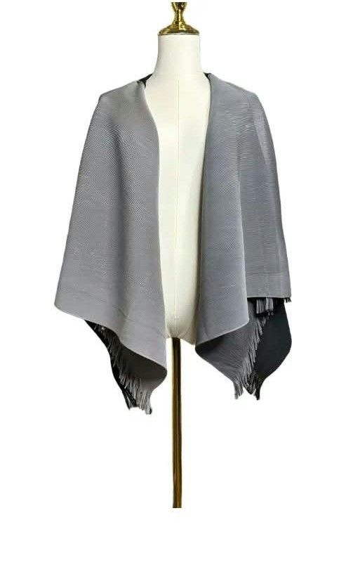 PLEAT PLEASE (Category: Others Tops) located in Taguig. Submitted by clothingselection (Listing ID 1470408271, Image 1). Description: PTPA Two-tone shawl in soft grey and black with delicate fringe trim. Lightweight fabric drapes beautifully—perfect for layering day or night PLEATS PLEASE ISSEY MIYAKE SIZE M TO XL CAN FIT EXCELLENT CONDITION NID WASH FRESH FROM BALE.