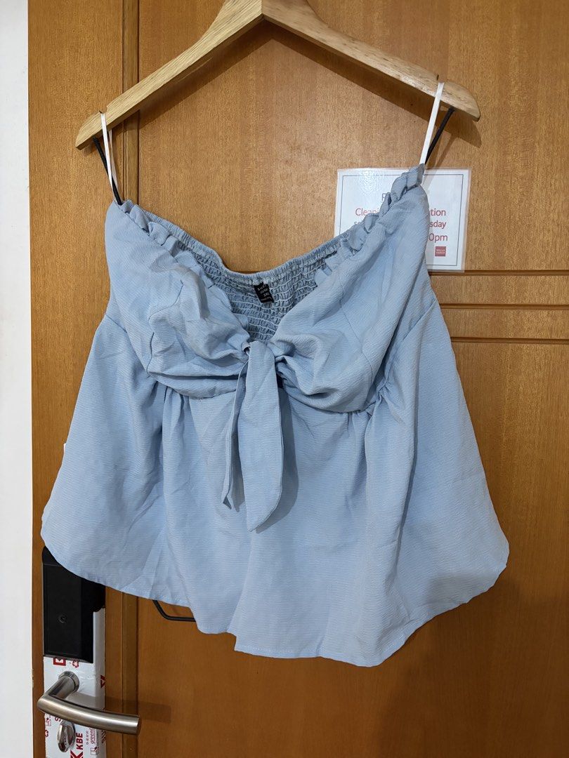 Plus size Tie Front Sexy tube Top (Category: Sleeveless) located in Taguig. Submitted by preloved_by_janel (Listing ID 1470503905, Image 1). Description: - Brand: SHEIN CUVEE - Size: 2X (Plus Size) - Color: Light Blue - Style: Strapless tube top with cute front tie detail, ruffled neckline trim and smocking back - Security: Interior silicone grip strip along the top edge to prevent slipping .