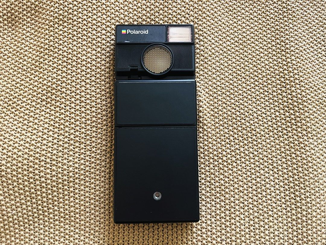 Polaroid SLR 680 SE (Refurbished 2024) (Category: Cameras) located in Rizal. Submitted by ndvxvnty (Listing ID 1470531326, Image 1). Description: - Model: Polaroid SLR 680 SE Folding Instant Camera - Fully working, no damage. - Price: 45,000 - Bought from Brooklyn Film Camera, USA for 47,000 plus 6,900 shipping fee and 12k plus Custom tax duty. - Color: Classic Black - Features: Built-in flash and sonar autofocus for sharp shots - Design: Iconic 