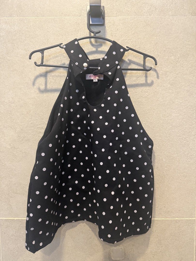 Polka dot halter top (Category: Sleeveless) located in Quezon City. Submitted by monmonmon13 (Listing ID 1470392366, Image 3). Description: Polka dot black and white halter top ♣️ - size SMALL - keyhole cutout at the neckline with a single pearl button closure - cotton linen fabric - never used, just fitted - no issues - retail price: P1749 - super nice for casual looks and the upcoming holidays 🎆.