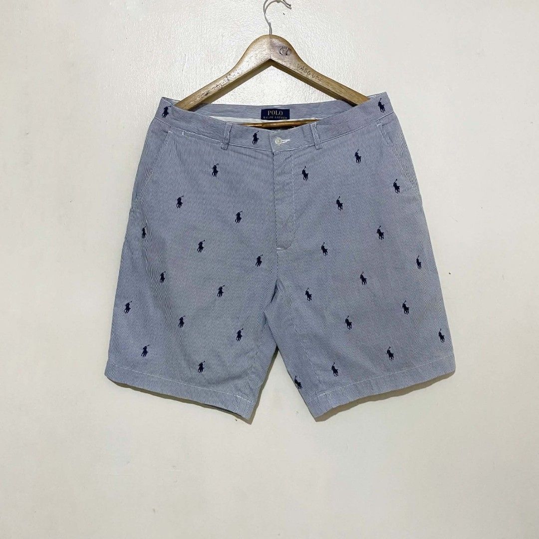 Polo Ralph Lauren (Category: Shorts) located in Manila. Submitted by jiiiiiiiiiims (Listing ID 1470485920, Image 1). Description: - Brand: Polo Ralph Lauren - Style: Blue and white seersucker stripes with all-over navy pony player print - Size: 33 - Features: Two front pockets, two buttoned back pockets - Origin: Made in Sri Lanka - Condition: Clean, excellent, ready to wear - Ideal for: Casual days and warm weather outings.