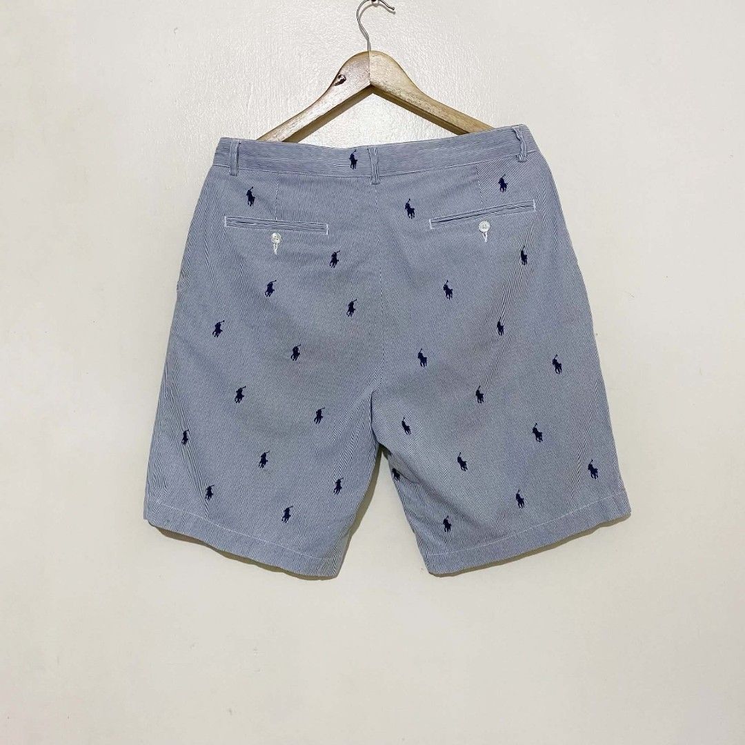 Polo Ralph Lauren (Category: Shorts) located in Manila. Submitted by jiiiiiiiiiims (Listing ID 1470485920, Image 2). Description: - Brand: Polo Ralph Lauren - Style: Blue and white seersucker stripes with all-over navy pony player print - Size: 33 - Features: Two front pockets, two buttoned back pockets - Origin: Made in Sri Lanka - Condition: Clean, excellent, ready to wear - Ideal for: Casual days and warm weather outings.
