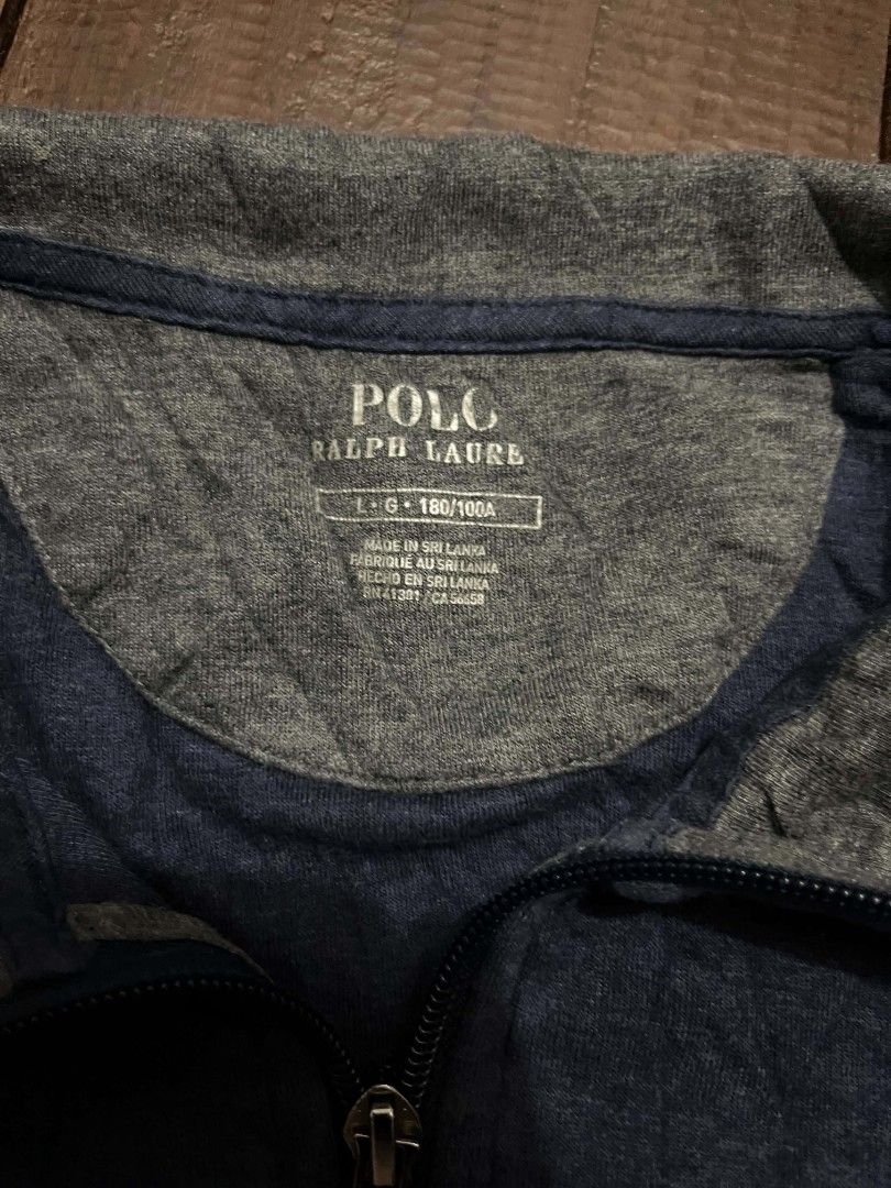 Polo Ralph Lauren Blue Quarter Zip Pullover (Category: Coats, Jackets and Outerwear) located in Manila. Submitted by adzwilnams67005 (Listing ID 1470500110, Image 3). Description: - Brand: Polo Ralph Lauren - Item: Cotton Quarter Zip Pullover - Color: Blue with contrast grey collar lining - Size: L (180/100A) - Details: Embroidered chest pony logo, branded zip hardware, ribbed cuffs and hem - Material: Soft cotton, made in Sri Lanka - Condition: 