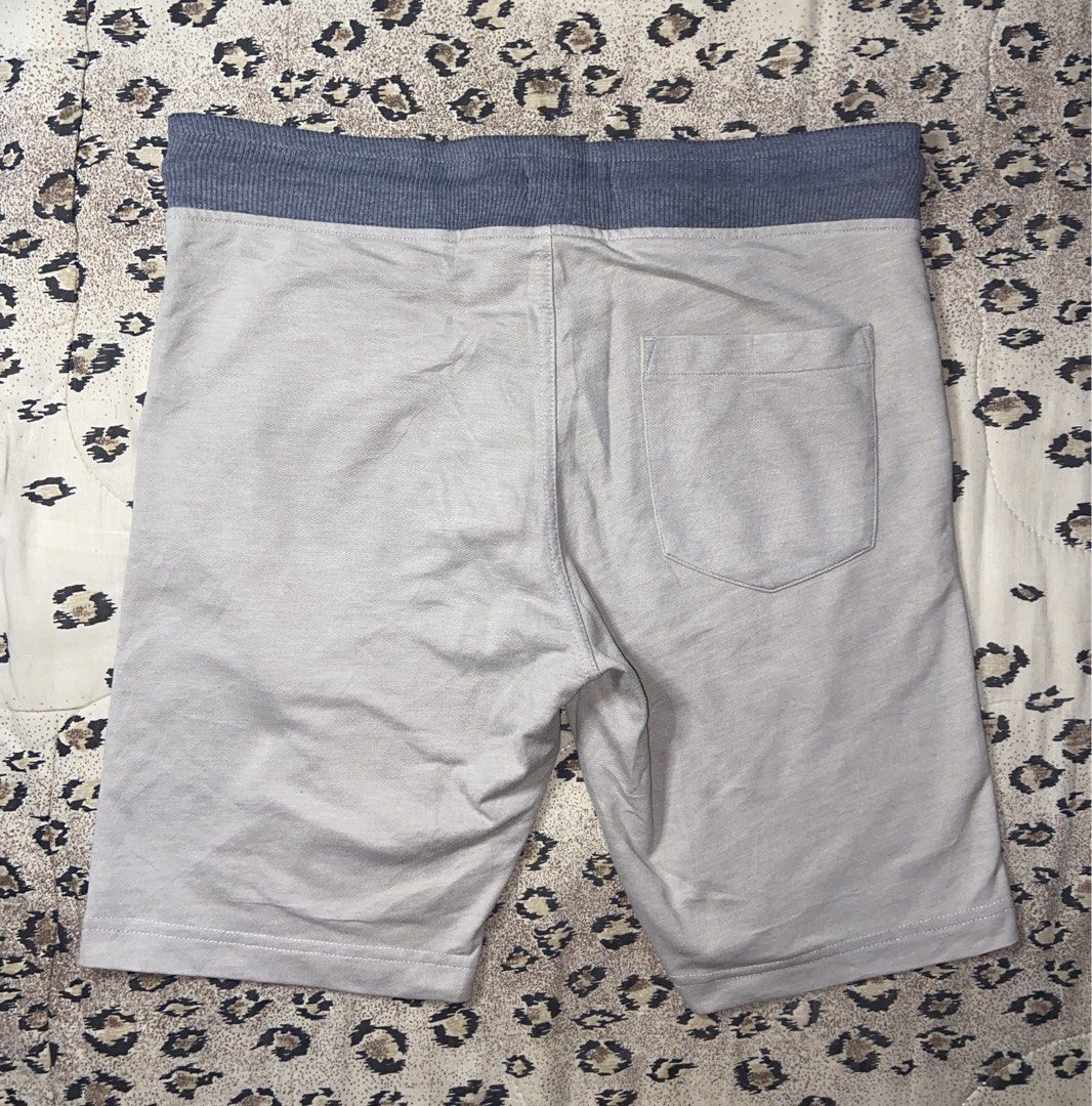 Polo Ralph Lauren grey drawstring sweat shorts size S (Category: Shorts) located in Manila. Submitted by nix.thrift (Listing ID 1470410694, Image 3). Description: - Brand: Polo Ralph Lauren - Color: Light grey with dark grey ribbed waistband - Size: S (tag attached) - Material: Soft and comfortable cotton blend - Details: Adjustable drawstring cords, small red embroidered pony logo on front left - Pockets: Two side slip pockets and one back right
