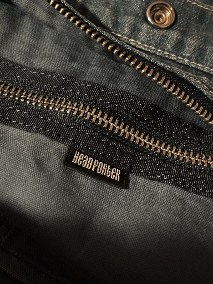 Porter Denim Tote Bag (Category: Tote Bags) located in Manila. Submitted by randomloots2 (Listing ID 1470461347, Image 3). Description: - Authentic Head Porter denim tote bag by Yoshida & Co (Made in Japan) - Crafted from sturdy denim with stylish contrast white stitching - Secure zip top closure with an additional snap button - Features multiple interior slip pockets for easy organization - Classic woven logo label on the front and branded inter