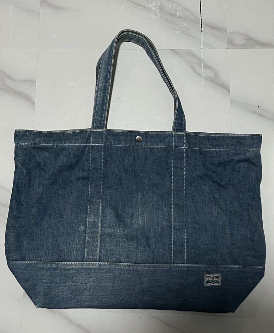 Porter Denim Tote Bag (Category: Tote Bags) located in Manila. Submitted by randomloots2 (Listing ID 1470461347, Image 1). Description: - Authentic Head Porter denim tote bag by Yoshida & Co (Made in Japan) - Crafted from sturdy denim with stylish contrast white stitching - Secure zip top closure with an additional snap button - Features multiple interior slip pockets for easy organization - Classic woven logo label on the front and branded inter