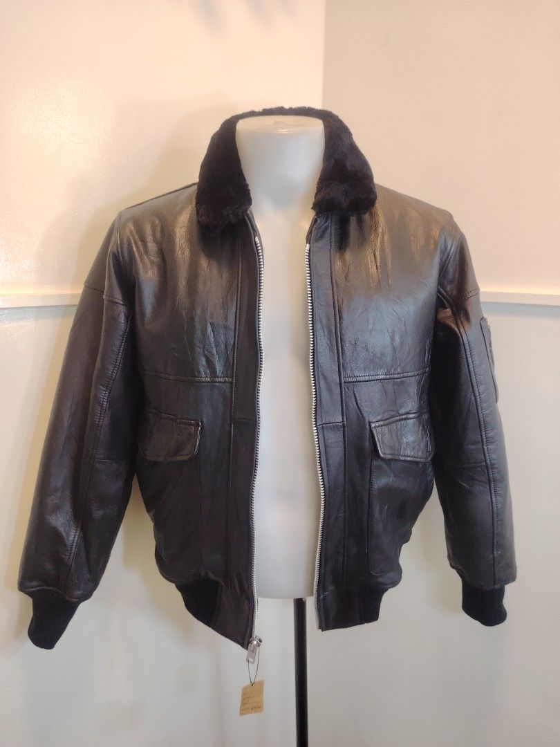 Posh Boy Black Leather Bomber Jacket Fur Collar (Category: Coats, Jackets and Outerwear) located in La Trinidad. Submitted by padasem_kadi (Listing ID 1470359832, Image 2). Description: - Brand: Posh Boy - Material: Black leather with warm quilted lining - Collar: black fur collar - Closure: Front zip - Details: Ribbed knit cuffs and hem, two front flap pockets, and a sleeve utility pocket - Measurements: Chest 23.5 inches | Sleeves 24.5 inches |