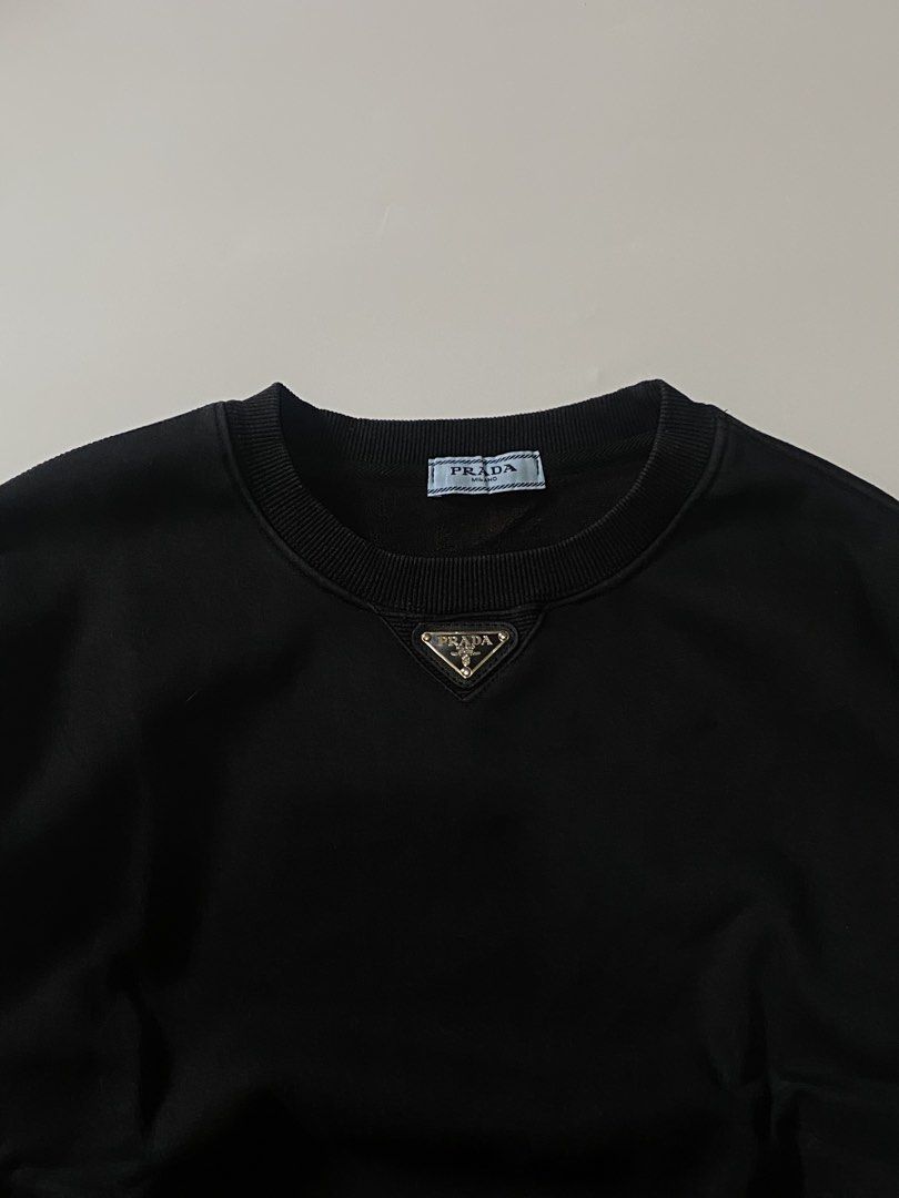 Prada Black Sweatshirt (Category: Coats, Jackets and Outerwear) located in Manila. Submitted by finofindthisart (Listing ID 1470532354, Image 3). Description: Length 24 Width 22 Measured it by inches Issue: N/A This is a pre-loved/thrifted items and may show minor signs of issue due to its vintage nature. Kindly manage expectations. No refunds or exchanges will be accepted. 📍Pasay City DM for inquiries..