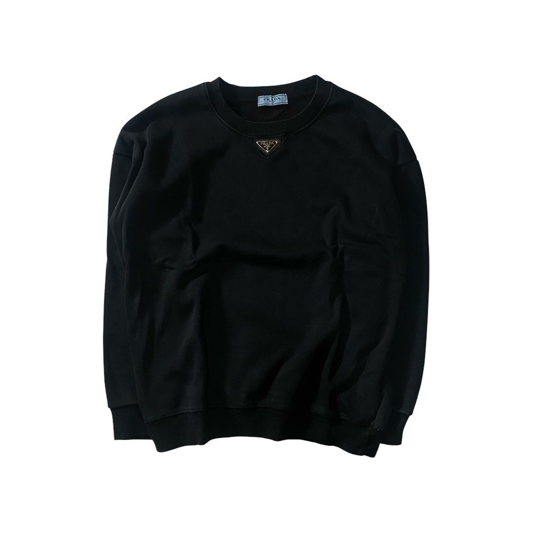 Prada Black Sweatshirt (Category: Coats, Jackets and Outerwear) located in Manila. Submitted by finofindthisart (Listing ID 1470532354, Image 1). Description: Length 24 Width 22 Measured it by inches Issue: N/A This is a pre-loved/thrifted items and may show minor signs of issue due to its vintage nature. Kindly manage expectations. No refunds or exchanges will be accepted. 📍Pasay City DM for inquiries..