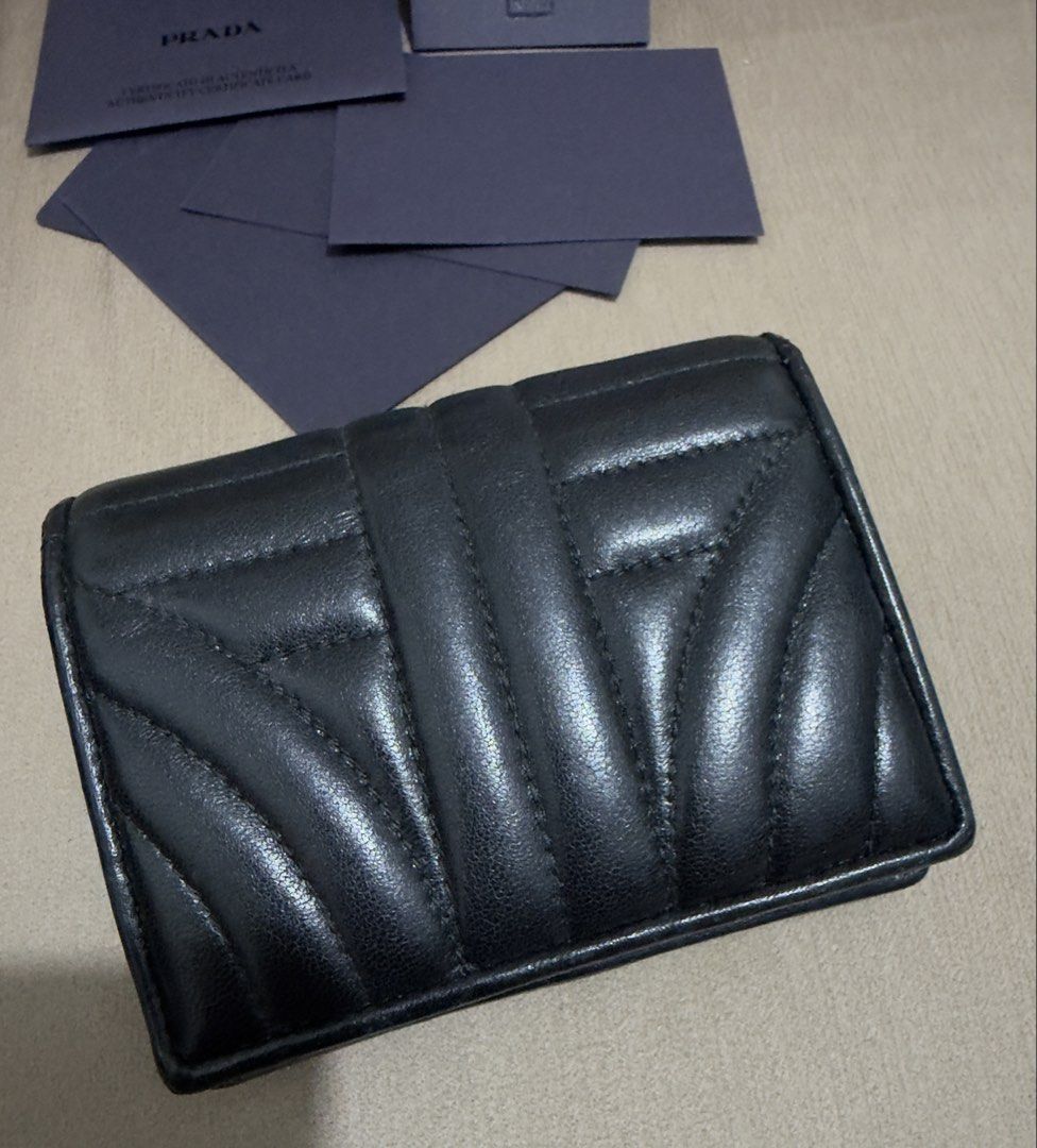 Prada Diagramme Bifold Wallet (RFID VERSION) (Category: Luxury Bags & Wallets) located in Valenzuela. Submitted by eande_manila (Listing ID 1470548076, Image 3). Description: Rank A+ In excellent condition No flaws, only minimal creasing on the inside Comes with box, card, rfid and LegitGrails 100% authentic.