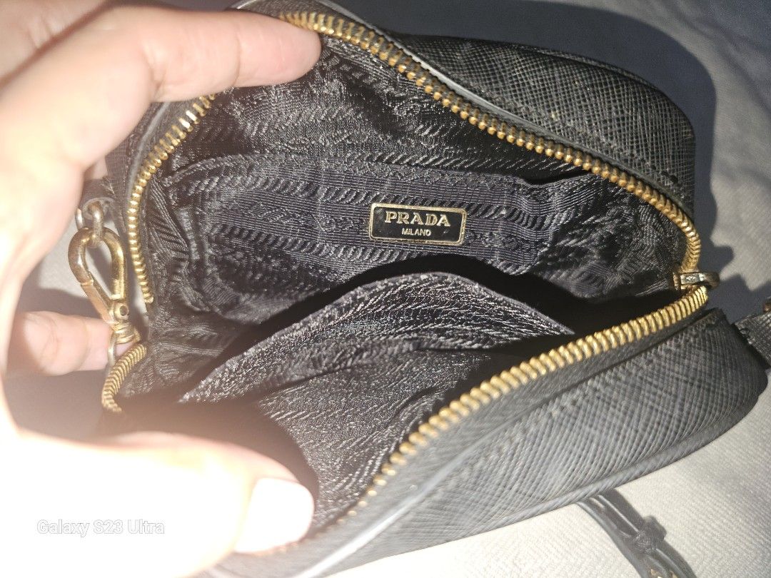 Prada Mini Saffiano Leather Crossbody Bag (Category: Cross-body Bags) located in Quezon City. Submitted by bagsforless16 (Listing ID 1470512044, Image 3). Description: Rare Authentic Mini Prada Saffiano Leather Camera Crossbody Bag Good Condition Gold Hardware with Prada Logo Lining with Embossed Prada Logo Saffiano Leather Strap For Daily Essentiaks .
