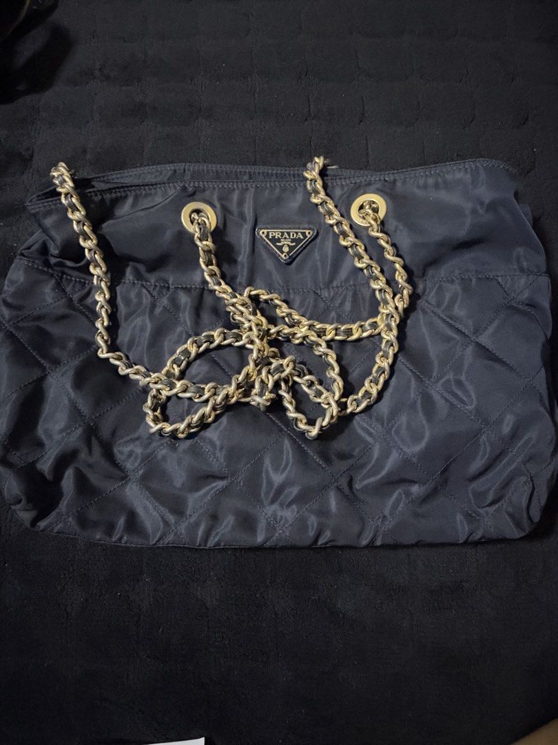 Prada Nylon Bag (Category: Luxury Bags & Wallets) located in Taguig. Submitted by ljlucero (Listing ID 1470459783, Image 1). Description: Slight faded in the chain.