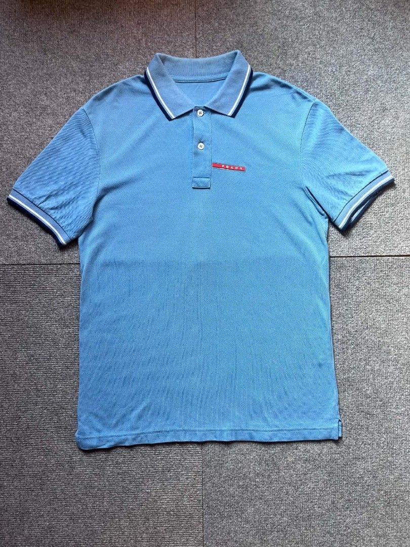 PRADA POLO SHIRT (Category: Tshirts & Polo Shirts ) located in Tacloban City. Submitted by lcortuna0908183 (Listing ID 1470361674, Image 1). Description: PRADA POLO SHIRT DIMES: W 19 L 26.5 CR: 9.5/10 EXCELLENT CONDITION NO ISSUE ( COLOR MAY DUE TO LIGHT) DM FOR MORE INFO📩.