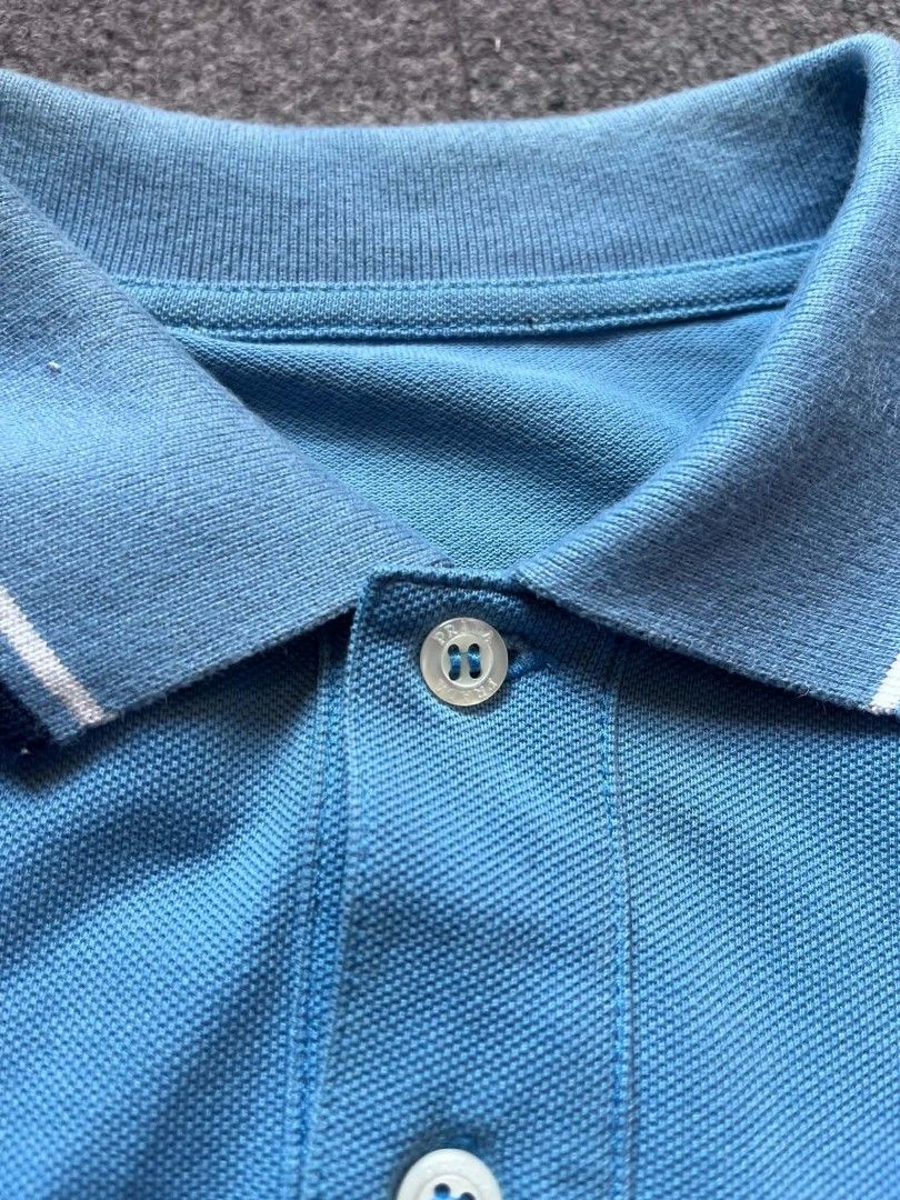 PRADA POLO SHIRT (Category: Tshirts & Polo Shirts ) located in Tacloban City. Submitted by lcortuna0908183 (Listing ID 1470361674, Image 2). Description: PRADA POLO SHIRT DIMES: W 19 L 26.5 CR: 9.5/10 EXCELLENT CONDITION NO ISSUE ( COLOR MAY DUE TO LIGHT) DM FOR MORE INFO📩.