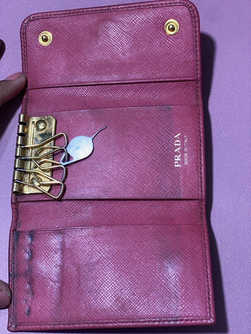 Prada Saffiano Leather Key Case Pink (Category: Luxury Bags & Wallets) located in Mandaue City. Submitted by cebuanacloset (Listing ID 1470437984, Image 2). Description: - Authentic Prada key case in stylish pink Saffiano leather - Elegant gold-tone hardware with iconic PRADA Milano logo plate - Secure snap button closure - Practical interior with built-in key hooks and slip pockets .