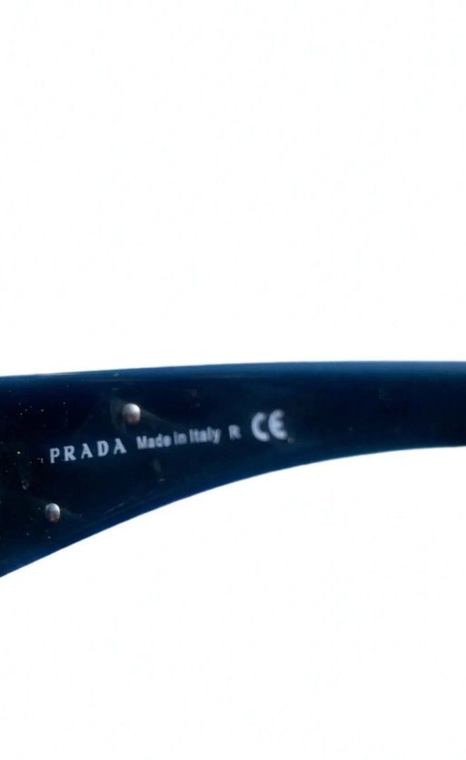 Prada SPR 57L Sunglasses (Category: Sunglasses & Eyewear) located in Manila. Submitted by clevershark.f2840d (Listing ID 1470543607, Image 2). Description: - Brand: Prada - Model: SPR 57L 7ZO-3M1 120 2N - Design: Sleek dark frames with stylish gradient lenses - Condition: Minimal wear on hardware and lenses, excellent everyday pair - Inclusions: Original black Saffiano leather hard case, matching cleaning cloth, and outer box - Trusted seller: Bu
