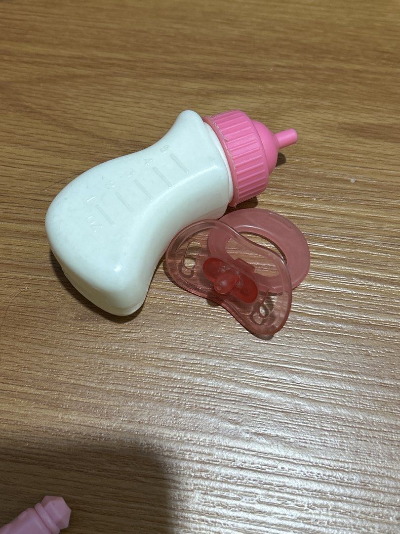 Pretend baby alive bottle and pacifier set (Category: Kids Toys) located in Pateros City. Submitted by cleanmycloset (Listing ID 1470507558, Image 1). Description: Preloved, unless stated brandnew. All items are declared AS IS. Pls manage your expectations. Tiktok checkout at your own risk or direct Jnt for safety. Lalamove for nearby areas and big items. Coin is used for size comparison. Follow me on tiktok @cleanmyclosetph & @cleanmyclosetph1 .