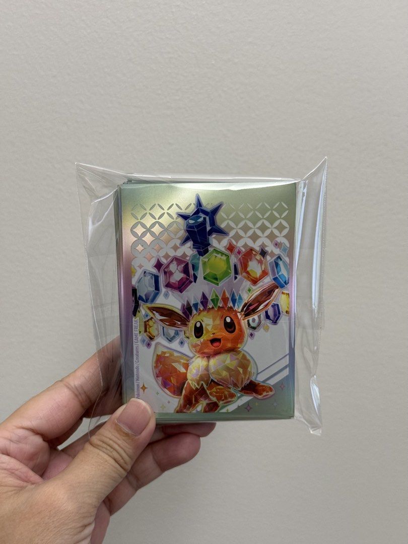 Prismatic ETB Eevee Sleeves (Category: Card Packs) located in Pasig City. Submitted by eiramcat01 (Listing ID 1470410314, Image 1). Description: Prismatic Evolutions ETB Sleeves - opened but not used - 65 pcs.