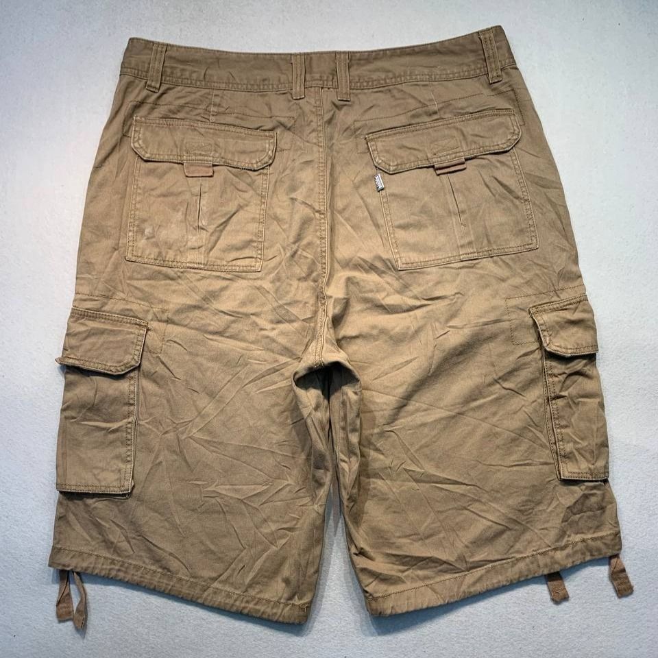 Pro Club Cargo Shorts Brown (Category: Shorts) located in Mandaluyong City. Submitted by theroom501 (Listing ID 1470514929, Image 2). Description: Pro Club Cargo Shorts Khaki Style Code: RN#100418 Size on Tag: 38 Color: Khaki Condition: Good pre-owned condition with a heavily distressed vintage look. Authenticity Flaws/Issues: Visible bleach stains on the fabric. Flat Lay Measurements: Pit to Pit: 38 inches Length: 26 inches Leeg opening Length: 