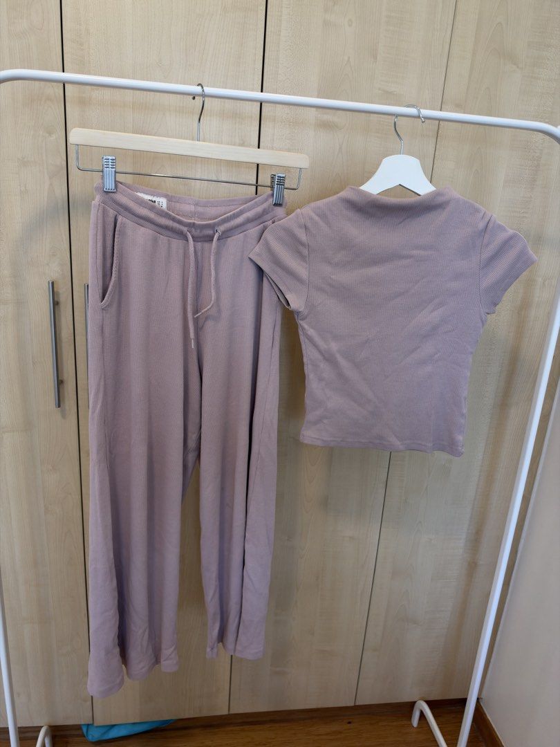Pull & Bear Dusty Pink Ribbed Top and Pants Set (Category: Sets or Coordinates) located in Makati City. Submitted by itsmeann09 (Listing ID 1470392608, Image 2). Description: - Brand: Pull & Bear - Color: Dusty pink - Material: Comfortable ribbed texture throughout - Top: Short sleeves, fitted cut, Size XS - Bottoms: Elastic drawstring waistband, wide-leg style, Size S - Condition: Clean and well-maintained - Perfect for: Casual wear or stylish l