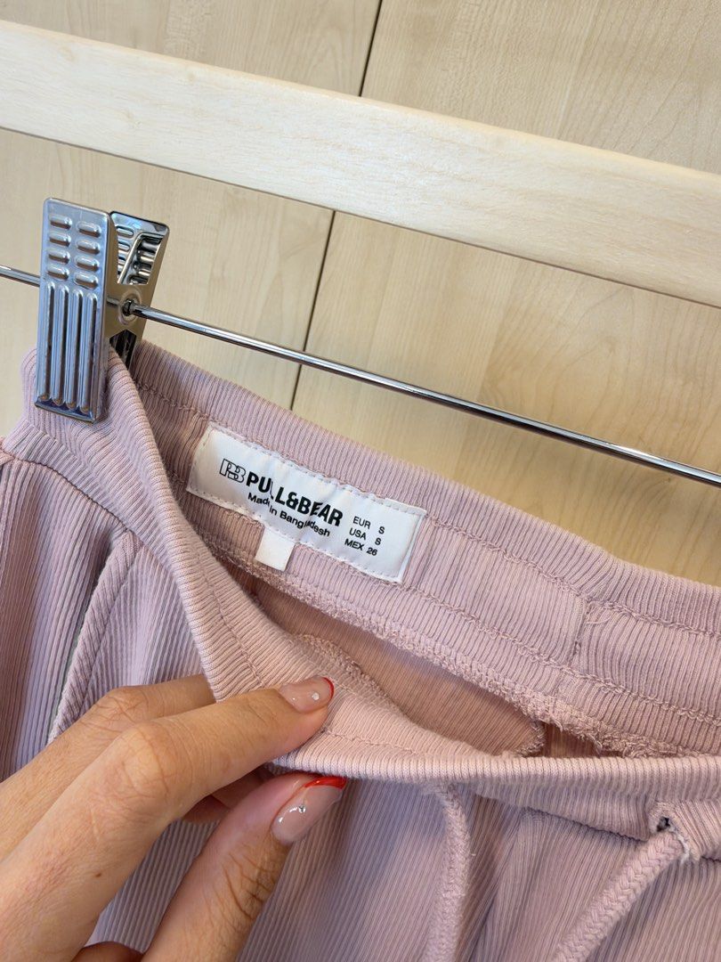 Pull & Bear Dusty Pink Ribbed Top and Pants Set (Category: Sets or Coordinates) located in Makati City. Submitted by itsmeann09 (Listing ID 1470392608, Image 3). Description: - Brand: Pull & Bear - Color: Dusty pink - Material: Comfortable ribbed texture throughout - Top: Short sleeves, fitted cut, Size XS - Bottoms: Elastic drawstring waistband, wide-leg style, Size S - Condition: Clean and well-maintained - Perfect for: Casual wear or stylish l